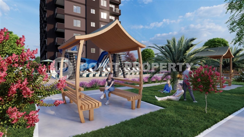 A new project in the picturesque area of Mersin - Cesmeli - a 10-storey residential complex with rich internal infrastructure-id-5973-photo-3