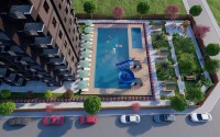 A new project in the picturesque area of Mersin - Cesmeli - a 10-storey residential complex with rich internal infrastructure-id-5973-photo-7