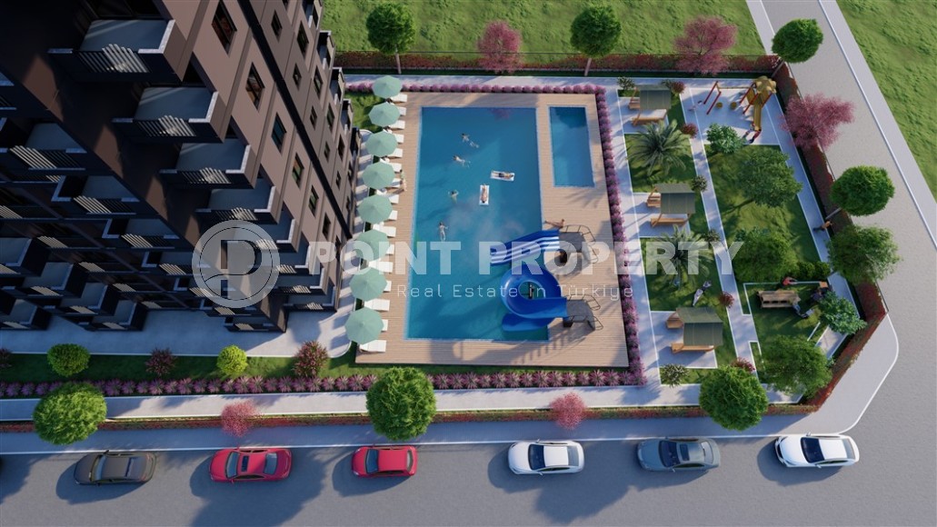 A new project in the picturesque area of Mersin - Cesmeli - a 10-storey residential complex with rich internal infrastructure-id-5973-photo-7