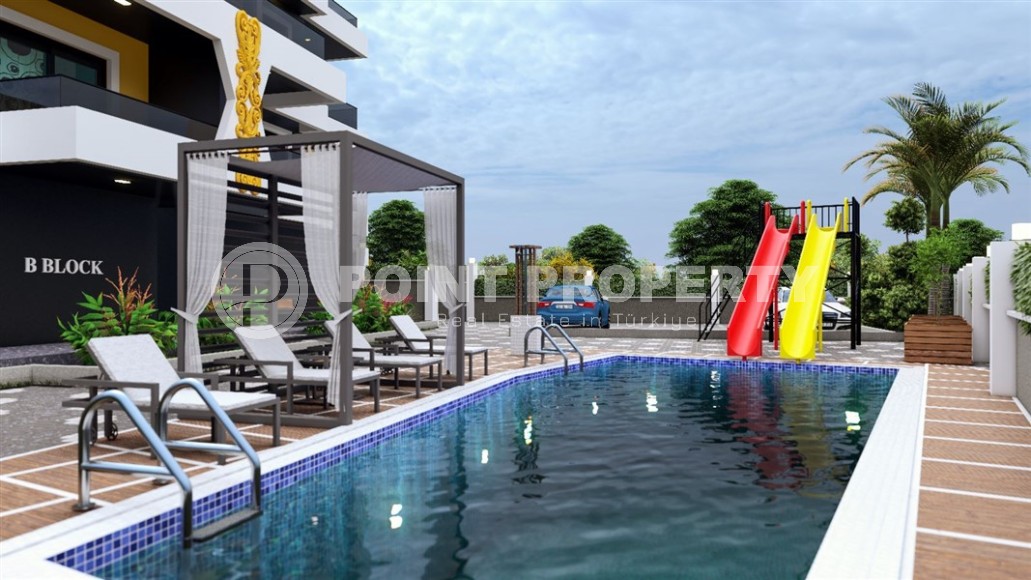 Apartments and duplexes in a residential complex under construction, in the promising area of Alanya - Ciplakli-id-6008-photo-4