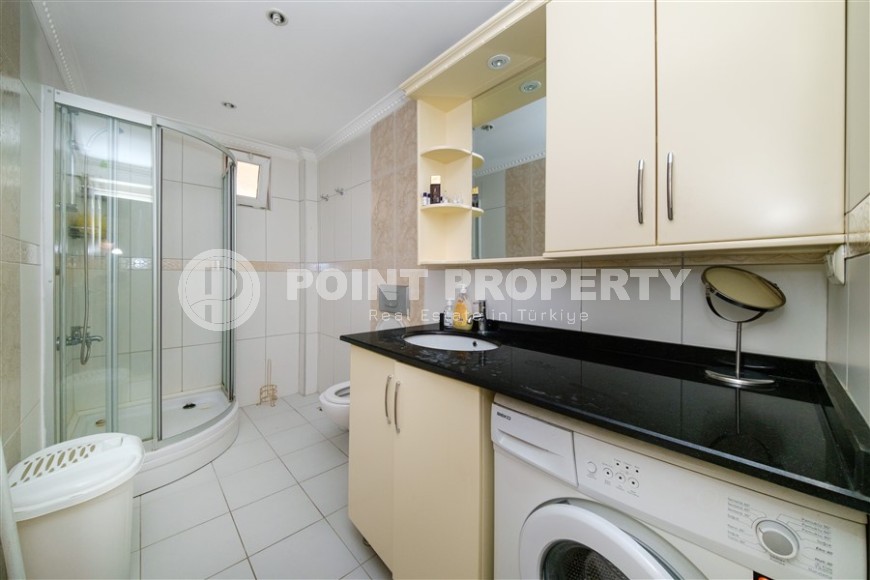 Modern apartment with spacious glazed balconies, five minutes walk from the center of Alanya-id-6071-photo-10