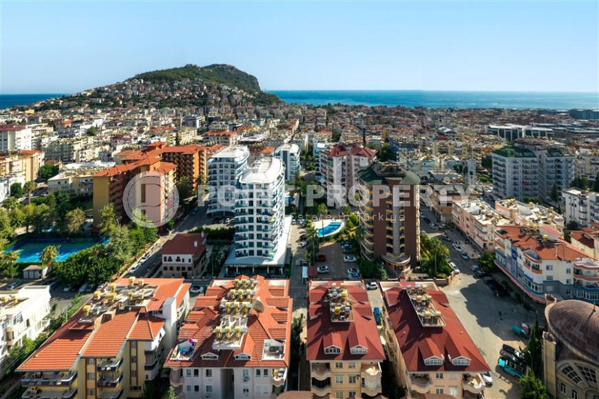Modern apartment with spacious glazed balconies, five minutes walk from the center of Alanya-id-6071-photo-19