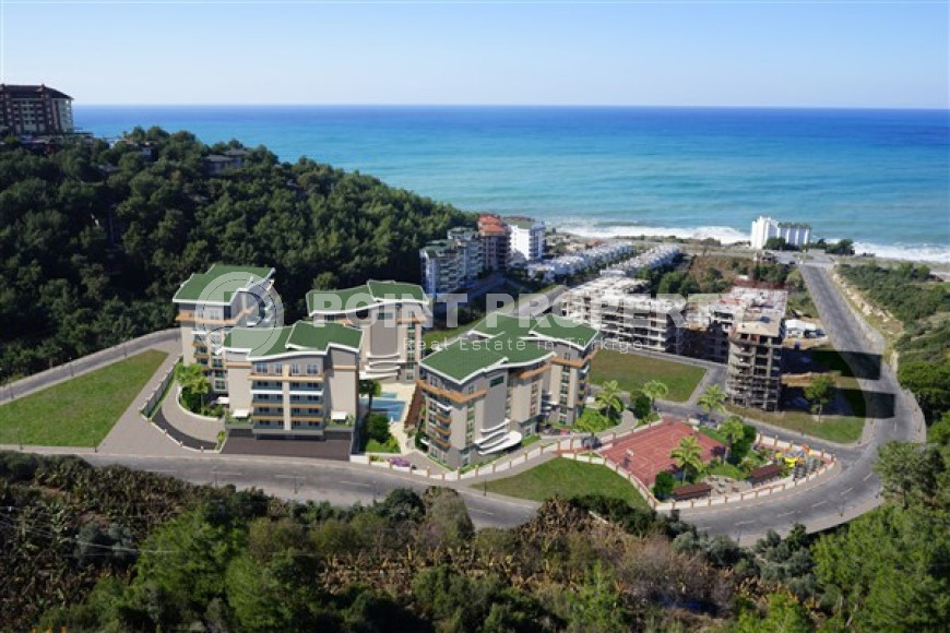 Двухуровневая трехкомнатная квартира, 180м², в новом комплексе в 500м от моря в районе Алании - Каргыджак-id-1487-фото-12