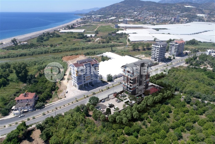 Apartments and duplexes in a residential complex under construction, in a picturesque, ecologically clean area of Alanya - Demirtas-id-6351-photo-12