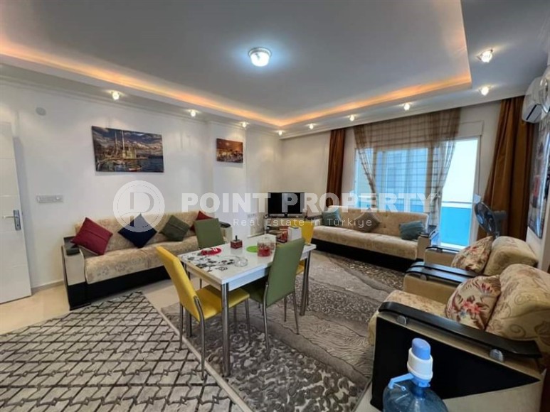 Spacious one bedroom apartment, on an area of 75 m2, in the center of a modern, developed area of Alanya - Mahmutlar-id-6361-photo-2