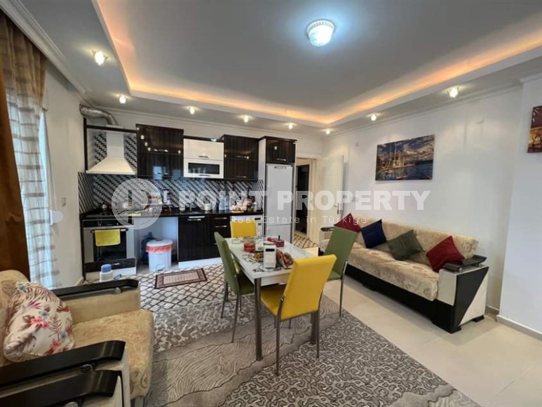 Spacious one bedroom apartment, on an area of 75 m2, in the center of a modern, developed area of Alanya - Mahmutlar-id-6361-photo-3