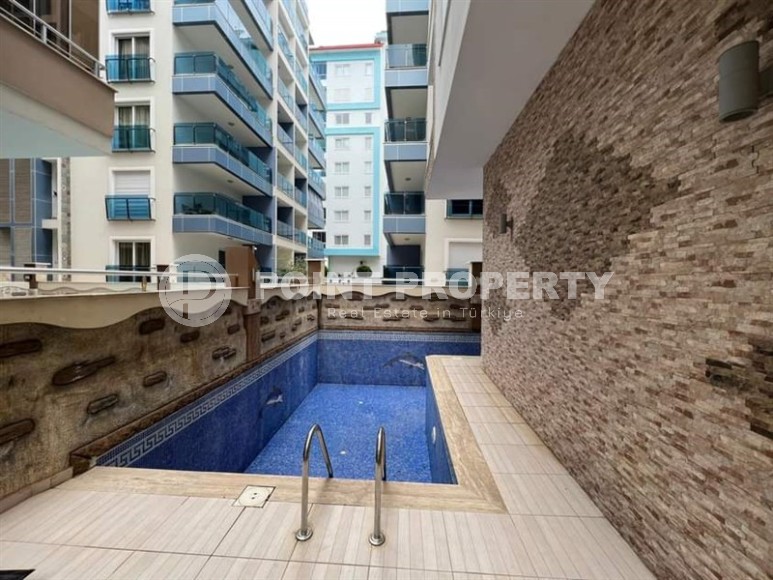 Spacious one bedroom apartment, on an area of 75 m2, in the center of a modern, developed area of Alanya - Mahmutlar-id-6361-photo-13