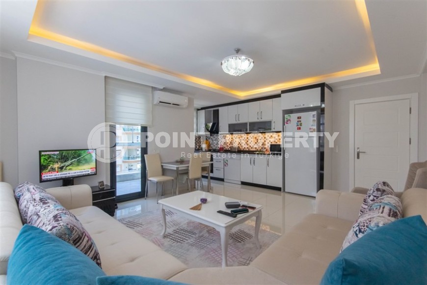 Bright, comfortable apartment 1+1, on an area of 70 m2, on the 4th floor, in the center of a modern, developed area of Alanya - Mahmutlar-id-6416-photo-2
