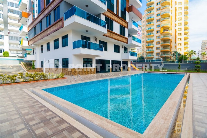 Bright, comfortable apartment 1+1, on an area of 70 m2, on the 4th floor, in the center of a modern, developed area of Alanya - Mahmutlar-id-6416-photo-14