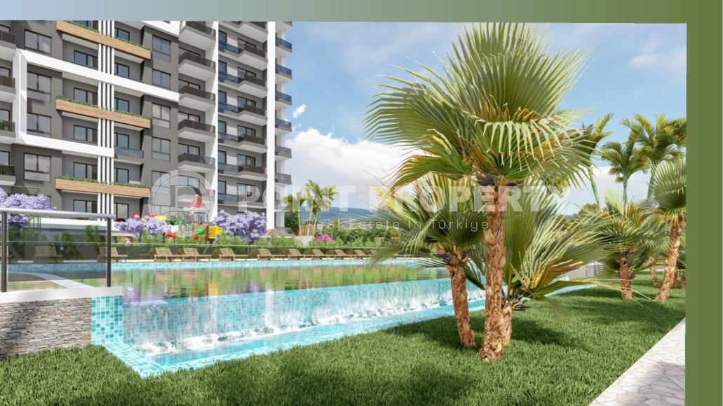 Апартаменты в жилом комплексе на этапе строительства, в популярном курортном и коммерческом районе Мерсина - Аяш-id-6517-фото-3