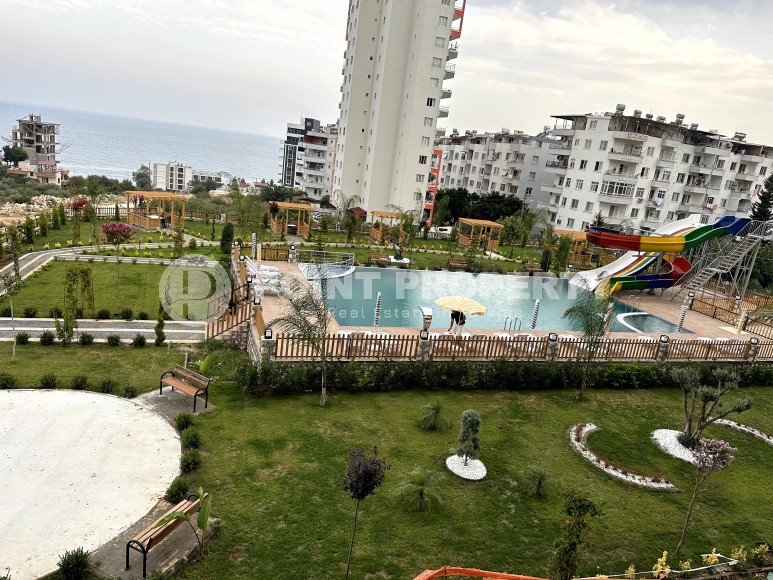 Апартаменты в жилом комплексе на этапе строительства, в популярном курортном и коммерческом районе Мерсина - Аяш-id-6517-фото-8