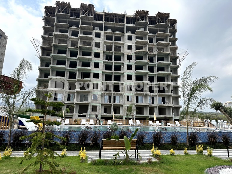 Апартаменты в жилом комплексе на этапе строительства, в популярном курортном и коммерческом районе Мерсина - Аяш-id-6517-фото-10