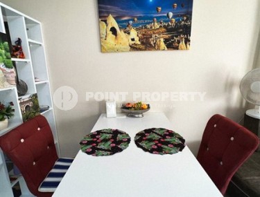 Small, ready-to-move-in 1+1 apartment 250 meters from the sea, in the center of Mahmutlar-id-6535-photo-4