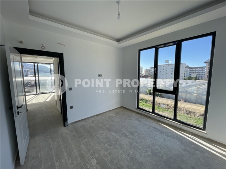 Двухкомнатная квартира, 50м², в комплексе на этапе строительства в 217м от моря, Аланья, Каргыджак-id-2167-фото-4