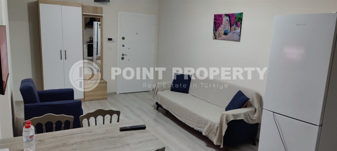 Небольшая меблированная квартира на 8-м этаже, в центре курортного района Мерсина - Эрдемли-id-6564-фото-2