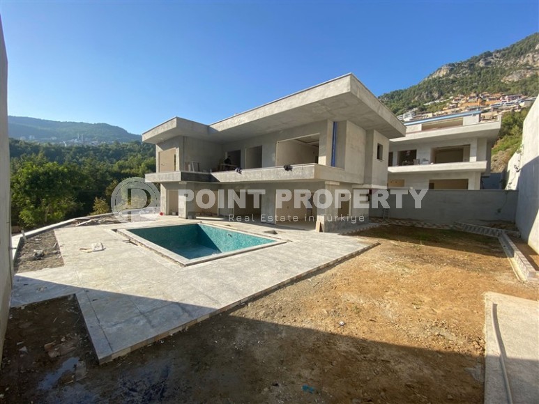 Две стильные новые виллы в живописной, экологически чистой местности, в элитном районе Аланьи - Бекташ-id-6664-фото-13