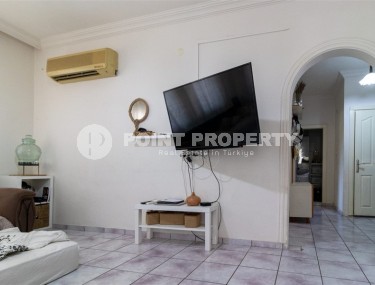 Affordable 2+1 apartment, on an area of 90 m2, in a building built in 1999, in the center of Mahmutlar district-id-6666-photo-2