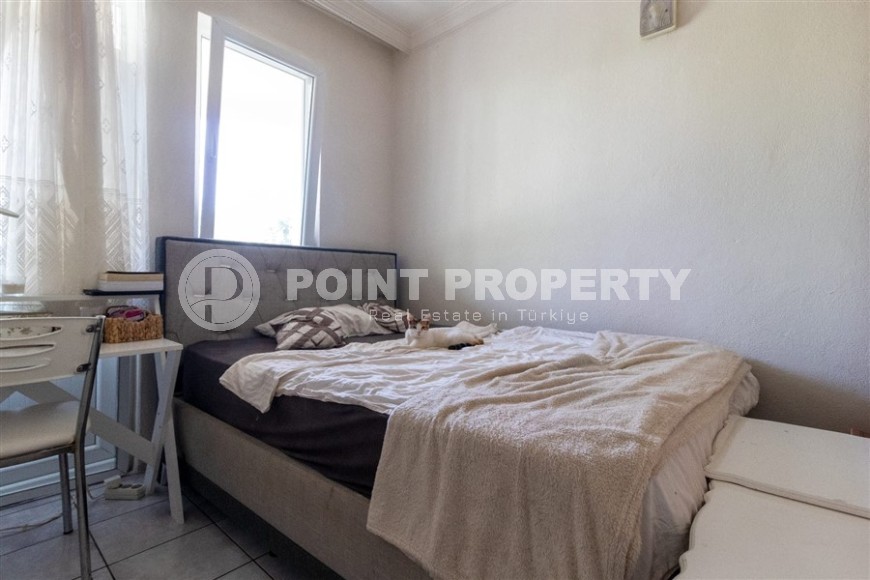 Affordable 2+1 apartment, on an area of 90 m2, in a building built in 1999, in the center of Mahmutlar district-id-6666-photo-4