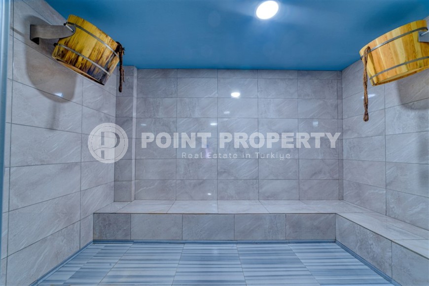 Комфортабельная двухуровневая квартира 2+1, с просторной террасой в саду, в 400 метрах от моря, в центре живописного, ухоженного района Аланьи - Кестель-id-6706-фото-18