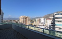 Панорамная квартира с видом на море и  горы, на 8-м этаже с мансардой, в центре современного района Аланьи - Махмутлар-id-6716-фото-19