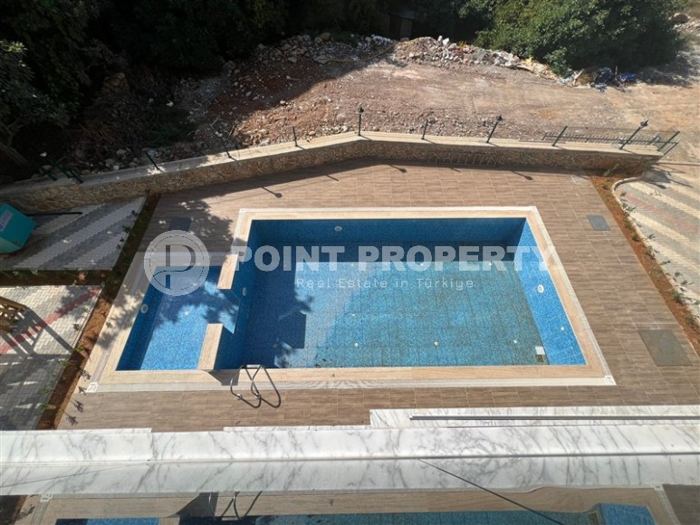 Компактная квартира 1+1, на площади 40 м2, в жилом комплексе 2022 года постройки, в живописном, ухоженном районе Аланьи - Нижняя Оба-id-6717-фото-12