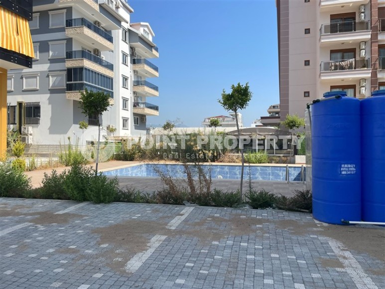 Small new 1+1 apartment 350 meters from the sea, in the center of a calm, picturesque area of Alanya - Kestel-id-6765-photo-12