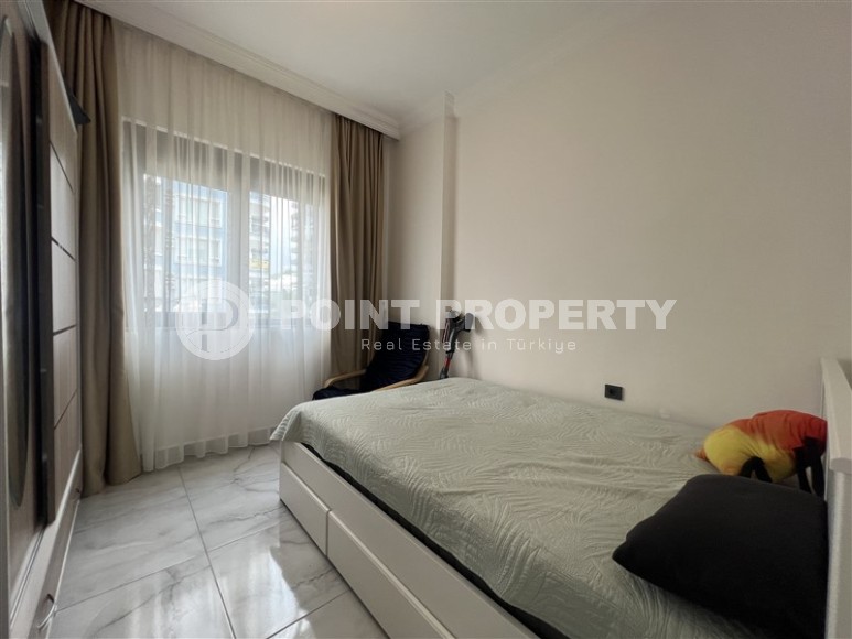 Современная квартира 1+1, на площади 55 м2, в благоустроенном жилом комплексе в центре района Махмутлар-id-6779-фото-4