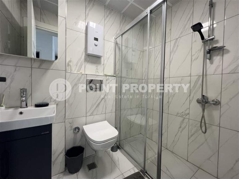 Современная квартира 1+1, на площади 55 м2, в благоустроенном жилом комплексе в центре района Махмутлар-id-6779-фото-5