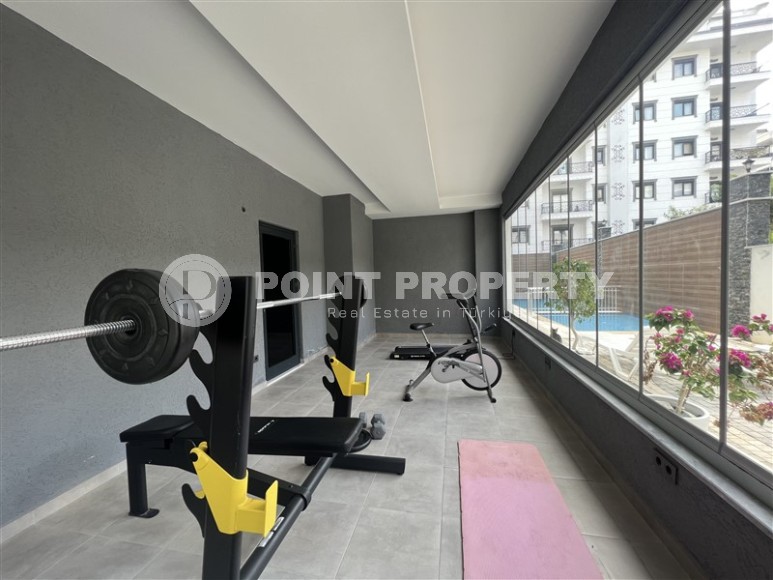 Современная квартира 1+1, на площади 55 м2, в благоустроенном жилом комплексе в центре района Махмутлар-id-6779-фото-7