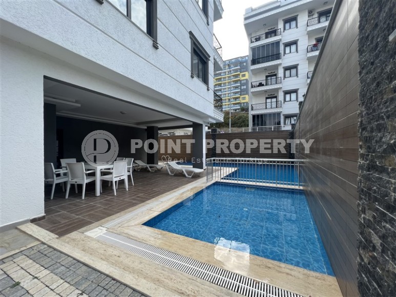 Современная квартира 1+1, на площади 55 м2, в благоустроенном жилом комплексе в центре района Махмутлар-id-6779-фото-11