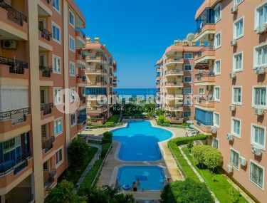 Designer two-bedroom apartment, 115m² in a cozy complex on the seafront in Mahmutlar-id-1530-photo-1