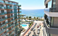 New three-room apartment, 85m², in an elite complex on the beach in Oba, Alanya-id-1531-photo-1