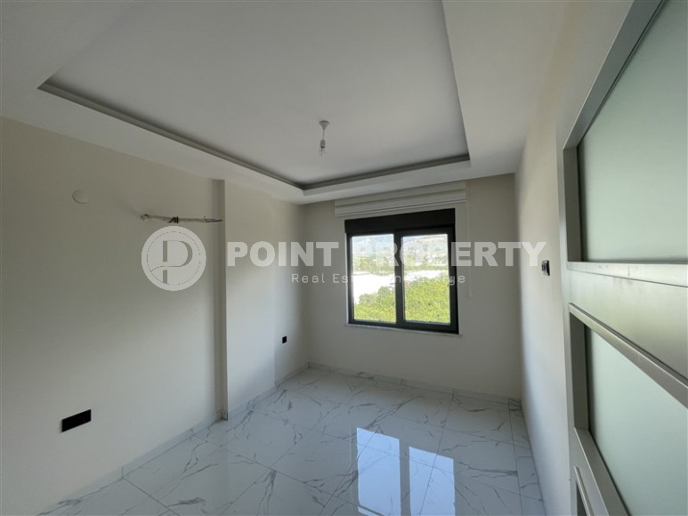 Spacious 2+1 apartment with views of the Taurus Mountains, on the 5th floor in a modern residence built in 2020-id-6851-photo-5