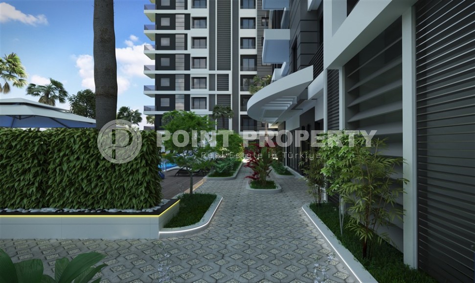 Квартира в жилом комплексе на этапе строительства в 200 метрах от моря, в центре района Махмутлар-id-6861-фото-11