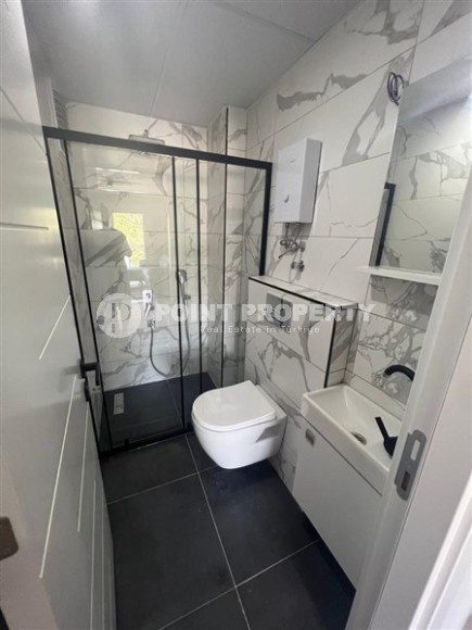 Компактная квартира 1+1, общей площадью 50 м2, на 1-м этаже в новой резиденции с бассейном и садом-id-6871-фото-4