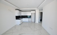 Small new apartment with fine finishing 500 meters from the beach, in the center of Mahmutlar-id-6912-photo-2