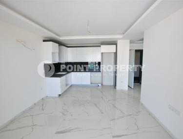 Small new apartment with fine finishing 500 meters from the beach, in the center of Mahmutlar-id-6912-photo-2