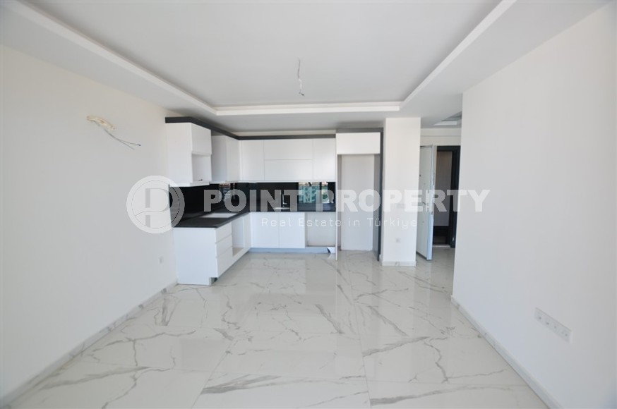 Small new apartment with fine finishing 500 meters from the beach, in the center of Mahmutlar-id-6912-photo-2