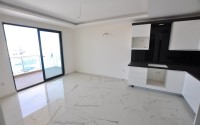 Small new apartment with fine finishing 500 meters from the beach, in the center of Mahmutlar-id-6912-photo-3