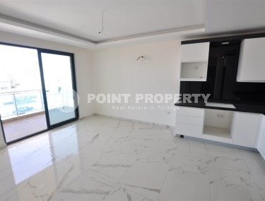 Small new apartment with fine finishing 500 meters from the beach, in the center of Mahmutlar-id-6912-photo-3