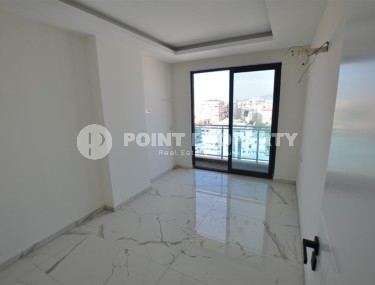 Small new apartment with fine finishing 500 meters from the beach, in the center of Mahmutlar-id-6912-photo-5