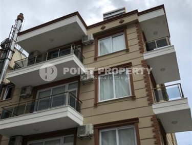 4-storey building with six apartments and a cafe on the 1st floor, in the center of Alanya-id-6917-photo-1