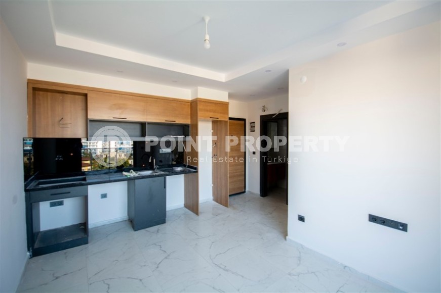 Compact 1+1 apartment with high-quality finishing 1800 meters from the sea, in the Mahmutlar area-id-6940-photo-2
