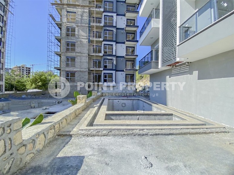 Компактная новая квартира 1+1 в двух километрах от моря, в живописном районе Аланьи - Авсаллар-id-6968-фото-11