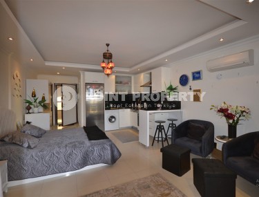 Благоустроенная студия, общей площадью 50 м2, на 1-м этаже, в центре района Авсаллар-id-6972-фото-1