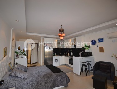 Благоустроенная студия, общей площадью 50 м2, на 1-м этаже, в центре района Авсаллар-id-6972-фото-2