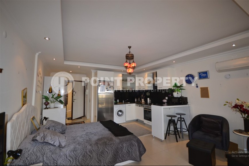 Благоустроенная студия, общей площадью 50 м2, на 1-м этаже, в центре района Авсаллар-id-6972-фото-2