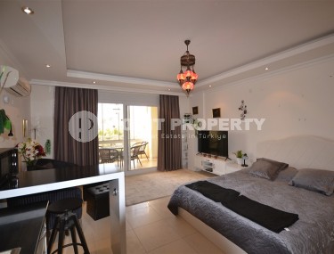 Благоустроенная студия, общей площадью 50 м2, на 1-м этаже, в центре района Авсаллар-id-6972-фото-3