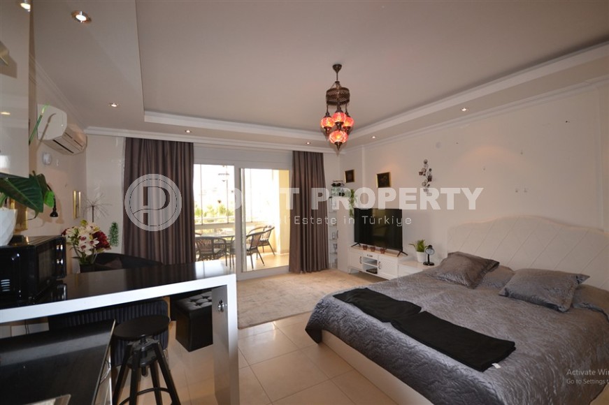 Благоустроенная студия, общей площадью 50 м2, на 1-м этаже, в центре района Авсаллар-id-6972-фото-3