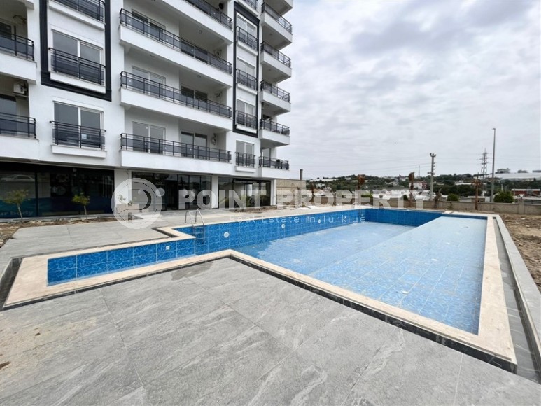 Small 1+1 apartment on the 8th floor in a residence at the final stage of construction.-id-4595-photo-2